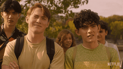 A Group Of People Standing Next To Each Other With A Netflix Logo On The Bottom GIF