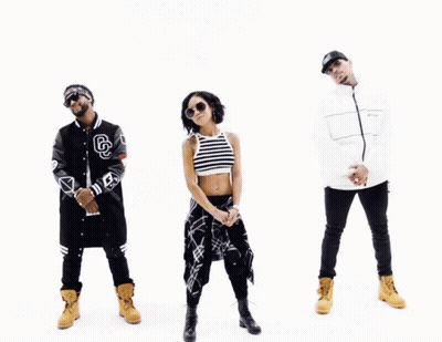 A Group Of People Standing Next To Each Other With One Wearing A Jacket With The Letter G On It GIF