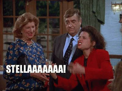 A Group Of People Standing Next To Each Other With One Woman Saying Stellaaaa ! GIF