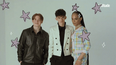 A Group Of People Standing Next To Each Other With The Word Attitude On The Bottom Right GIF