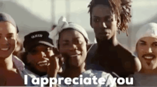 A Group Of People Standing Next To Each Other With The Words `` I Appreciate You '' On The Bottom . GIF