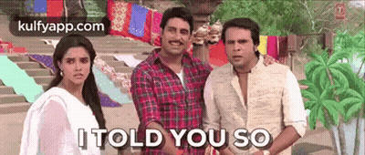 A Group Of People Standing Next To Each Other With The Words `` It Told You So '' Written On The Bottom . GIF