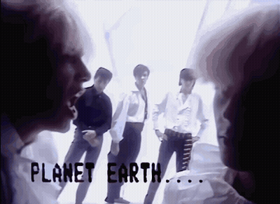 A Group Of People Standing Next To Each Other With The Words Planet Earth Written On The Bottom GIF