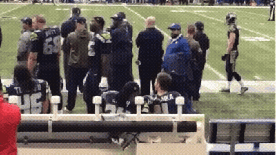 A Group Of People Standing On A Football Field With A Man Wearing A Jersey That Says Luka GIF
