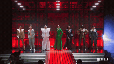 A Group Of People Standing On A Stage With Netflix Written On The Bottom GIF