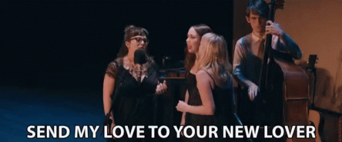 A Group Of People Standing On A Stage With The Words Send My Love To Your New Lover GIF