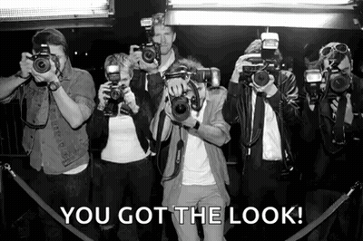 A Group Of People Taking Pictures With Their Cameras With The Caption " You Got The Look " Above Them GIF