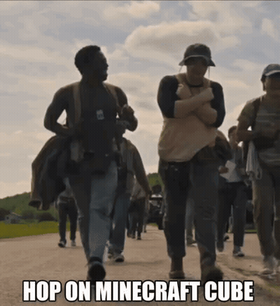A Group Of People Walking Down A Street With The Words Hop On Minecraft Cube On The Bottom GIF