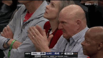 A Group Of People Watching A Basketball Game With The Espn Logo On The Screen GIF