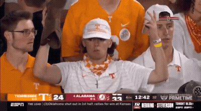 A Group Of People Watching A Football Game Between Tennessee And Alabama On Espn GIF