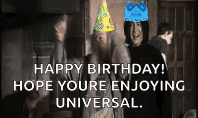 A Group Of People Wearing Birthday Hats Are Standing Next To Each Other . GIF