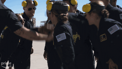 A Group Of People Wearing Ear Muffs And Jackets With The Word Prime On The Bottom Right GIF