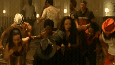 A Group Of People Wearing Hats Are Dancing GIF