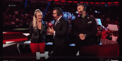 A Group Of People Wearing Headphones Are Standing In Front Of A Crowd On A Stage . GIF
