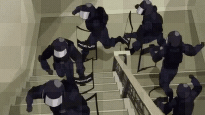 A Group Of Police Officers Are Running Down The Stairs . GIF
