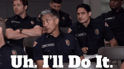 A Group Of Police Officers Are Sitting In A Room With The Words " Uh I 'Ll Do It " GIF