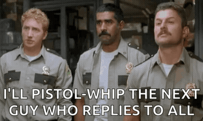 A Group Of Police Officers Are Standing Next To Each Other And One Of Them Is Holding A Gun . GIF