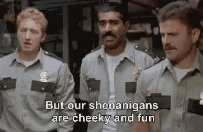 A Group Of Police Officers Are Standing Next To Each Other And Talking . GIF