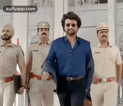 A Group Of Police Officers Are Standing Next To Each Other . GIF