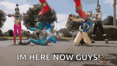 A Group Of Power Rangers Are Fighting Each Other On The Street And The Caption Says I 'M Here Now Guys GIF