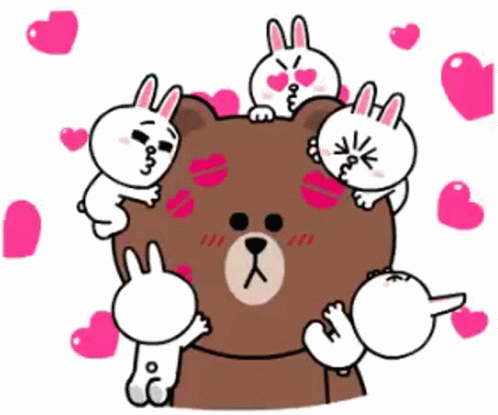 A Group Of Rabbits Are Standing Around A Brown Bear Surrounded By Hearts . GIF