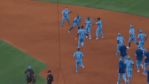 A Group Of Rangers Baseball Players Are Celebrating A Win GIF