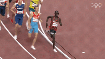 A Group Of Runners Are Running On A Track And One Of Them Is Wearing A Kenya Shirt GIF