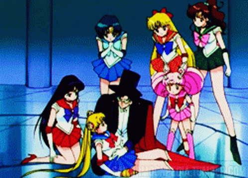A Group Of Sailor Moon Characters Standing Around A Man In A Top Hat GIF