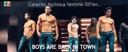 A Group Of Shirtless Men Are Standing On A Stage With The Words Boys Are Back In Town On The Bottom GIF