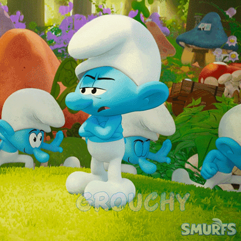 A Group Of Smurfs Are Standing In A Grassy Area With The Words Grouchy Smurfs Written On The Bottom GIF