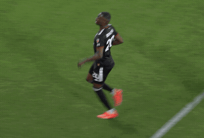 A Group Of Soccer Players Are Celebrating A Goal And One Of Them Has The Number 23 On His Back GIF