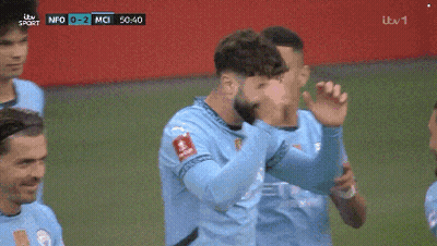 A Group Of Soccer Players Are Celebrating A Goal During A Game Sponsored By Itv Sport GIF