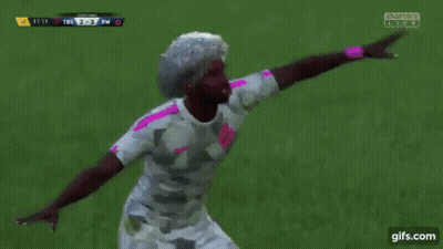 A Group Of Soccer Players Are Celebrating A Goal In Front Of A Fifa Sign GIF
