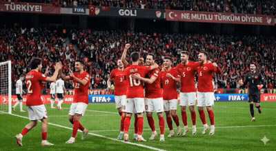 A Group Of Soccer Players Are Celebrating A Goal On A Field GIF