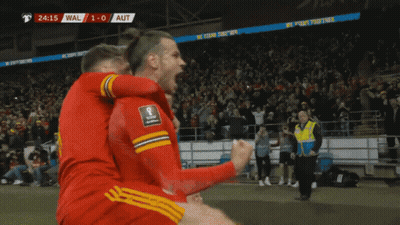 A Group Of Soccer Players Are Celebrating A Goal With The Score At 1-0 GIF