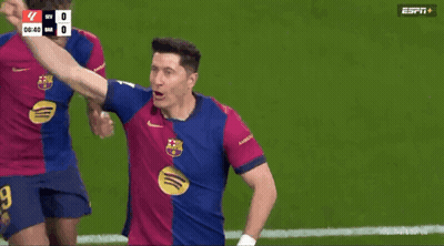 A Group Of Soccer Players Are Celebrating On A Field With A Espn Logo In The Background GIF
