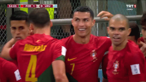 A Group Of Soccer Players Are Huddled Together And One Of Them Has The Number 7 On His Jersey GIF