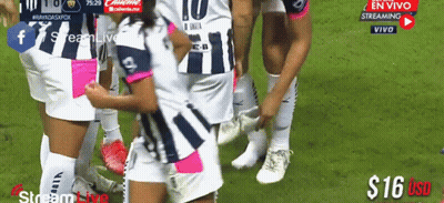 A Group Of Soccer Players Are Huddled Together On The Field GIF