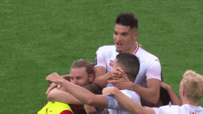 A Group Of Soccer Players Are Huddled Together With One Wearing A Jersey That Says " Pacific Medical " GIF