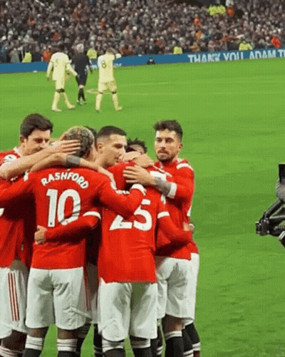 A Group Of Soccer Players Are Hugging Each Other On A Field And One Of Them Has The Number 10 On His Shirt GIF