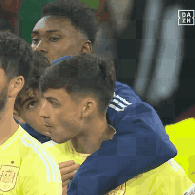 A Group Of Soccer Players Are Hugging Each Other With A Da Zn Logo In The Corner GIF