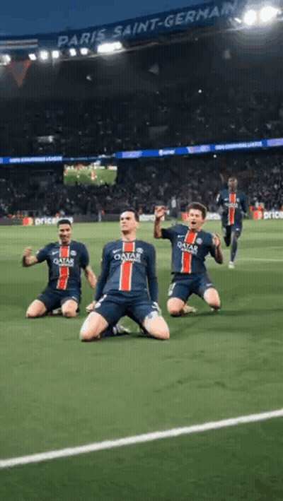 A Group Of Soccer Players Are Kneeling On The Field In Front Of A Crowd . GIF