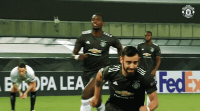A Group Of Soccer Players Are On A Field With A Fedex Ad In The Background GIF