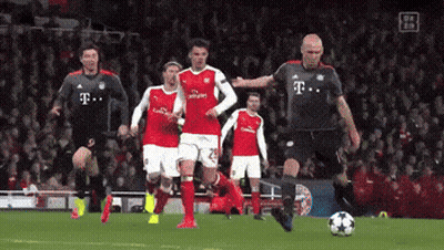 A Group Of Soccer Players Are Playing A Game And One Of Them Is Wearing A T-Mobile Jersey GIF