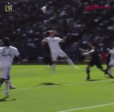 A Group Of Soccer Players Are Playing A Game Of Soccer On A Field GIF