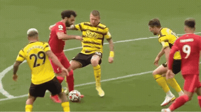 A Group Of Soccer Players Are Playing A Game Of Soccer On A Soccer Field . GIF