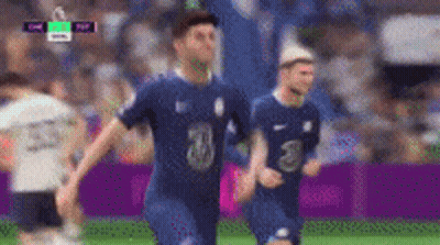 A Group Of Soccer Players Are Playing A Game On A Field . GIF