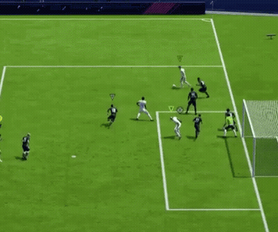 A Group Of Soccer Players Are Playing A Game On A Field With A Sign That Says Fifa On It GIF