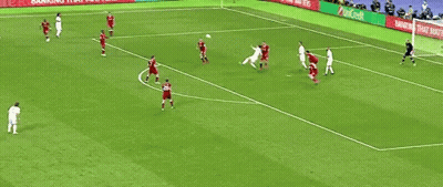 A Group Of Soccer Players Are Playing A Game On A Field With Advertisements On The Sidelines . GIF