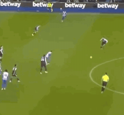 A Group Of Soccer Players Are Playing A Game On A Field With Betting Advertisements In The Background . GIF